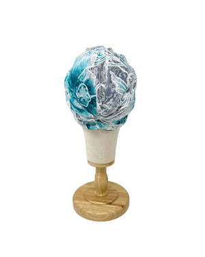 White lace turban with blue floral pattern